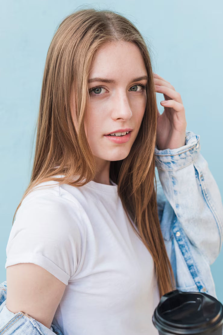 files/stylish-pretty-woman-looking-camera-holding-disposable-coffee-cup_23-2148193857.avif